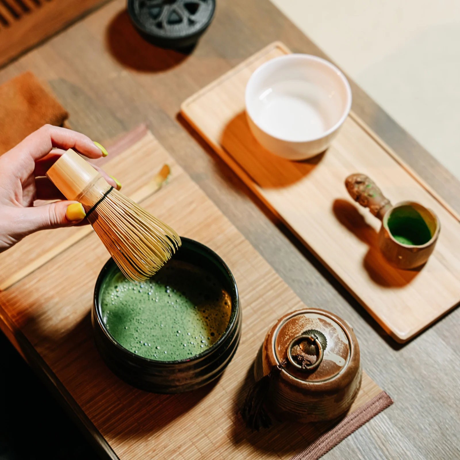 A tea ceremony setting, tools laid out with care